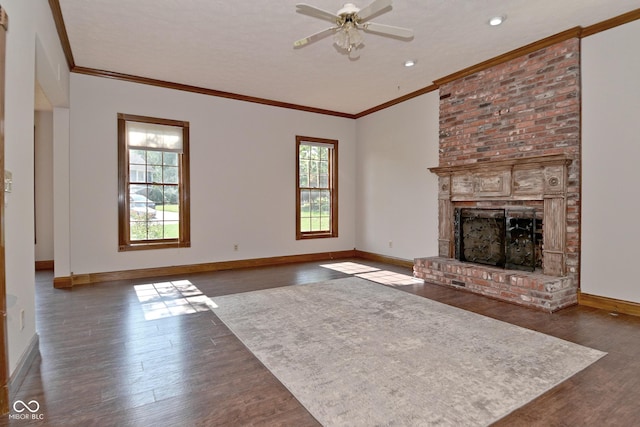 6567 Kings Ct, Avon, IN 46123 - unfurnished living room featuring dark wood-style floors, a brick fireplace, a ceiling fan, crown molding, and lofted ceiling