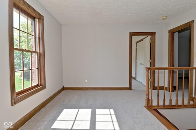 6567 Kings Ct, Avon, IN 46123 - spare room with plenty of natural light, carpet, a textured ceiling, and a smoke detector