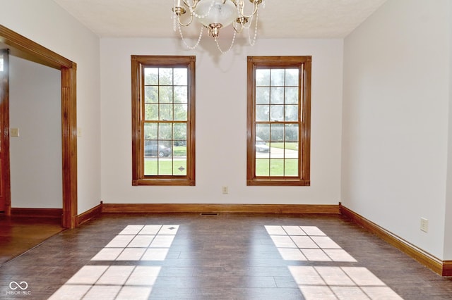 6567 Kings Ct, Avon, IN 46123 - empty room featuring wood finished floors and a chandelier