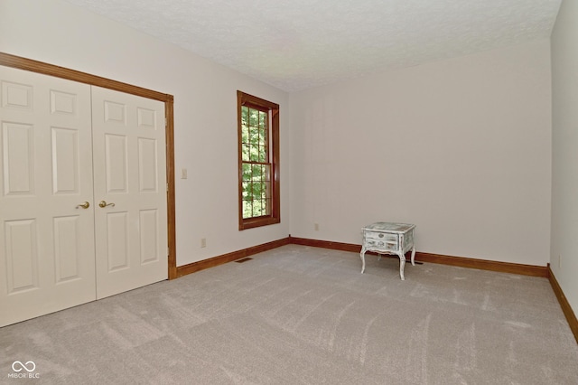 6567 Kings Ct, Avon, IN 46123 - unfurnished bedroom featuring carpet floors, a textured ceiling, and a closet