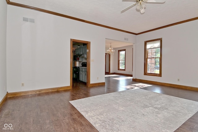 6567 Kings Ct, Avon, IN 46123 - spare room with dark wood-style flooring, a chandelier, crown molding, and a ceiling fan