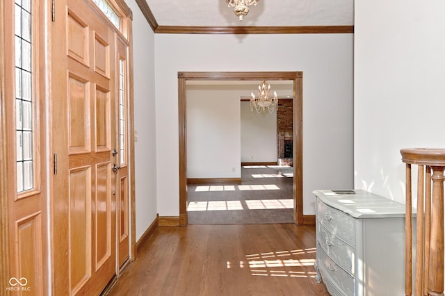 6567 Kings Ct, Avon, IN 46123 - corridor with a chandelier, wood finished floors, and ornamental molding
