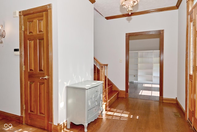 6567 Kings Ct, Avon, IN 46123 - hallway with wood finished floors and crown molding