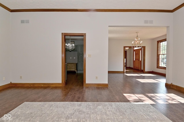 6567 Kings Ct, Avon, IN 46123 - unfurnished room with a chandelier, wood finished floors, and crown molding
