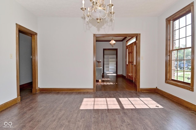 6567 Kings Ct, Avon, IN 46123 - unfurnished dining area with wood finished floors, a chandelier, and healthy amount of natural light