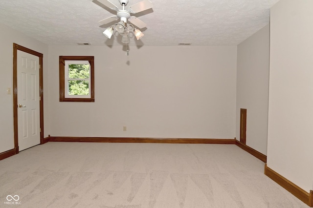 6567 Kings Ct, Avon, IN 46123 - unfurnished room with a textured ceiling, light carpet, and ceiling fan