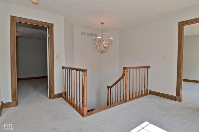 6567 Kings Ct, Avon, IN 46123 - stairway featuring carpet and a chandelier