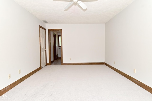 6567 Kings Ct, Avon, IN 46123 - spare room featuring ceiling fan, a textured ceiling, and light carpet