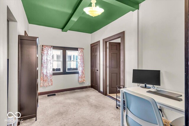 405 N Drexel Ave, Indianapolis, IN 46201 - home office featuring light carpet, baseboards, and beam ceiling