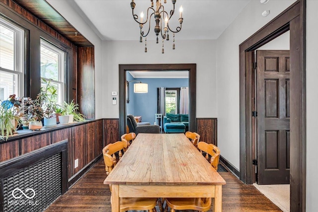 405 N Drexel Ave, Indianapolis, IN 46201 - dining room featuring dark wood-style flooring, a chandelier, healthy amount of natural light, and wainscoting