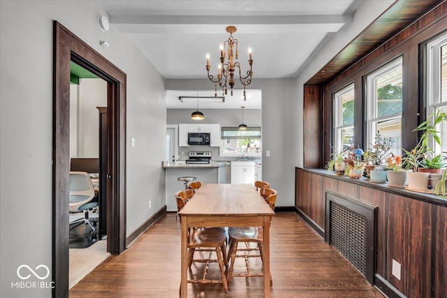 405 N Drexel Ave, Indianapolis, IN 46201 - dining space with dark wood-type flooring, a chandelier, and baseboards