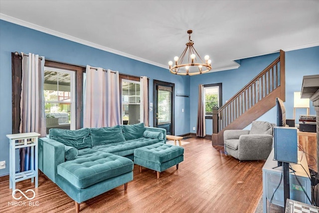 405 N Drexel Ave, Indianapolis, IN 46201 - living room with a chandelier, stairway, crown molding, wood finished floors, and baseboards