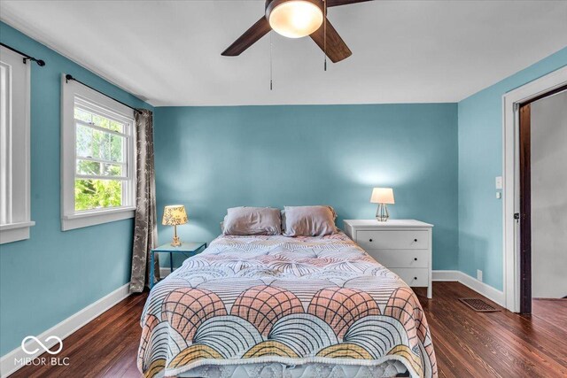 405 N Drexel Ave, Indianapolis, IN 46201 - bedroom with baseboards, wood finished floors, and a ceiling fan