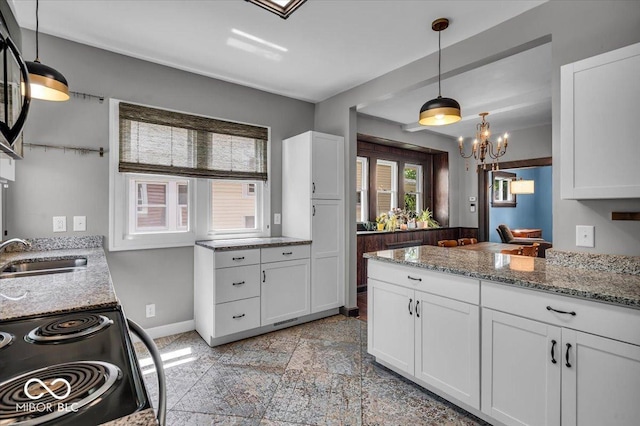 405 N Drexel Ave, Indianapolis, IN 46201 - kitchen featuring a sink, black range with electric stovetop, baseboards, light stone countertops, and white cabinets