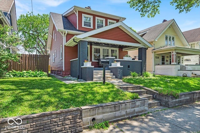 405 N Drexel Ave, Indianapolis, IN 46201 - view of front of house featuring covered porch and a chimney