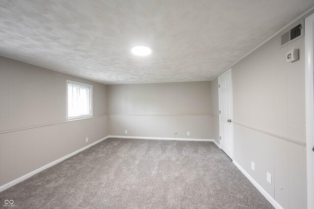 2740 Pawnee Dr, Indianapolis, IN 46229 - unfurnished room with carpet flooring, baseboards, and a textured ceiling