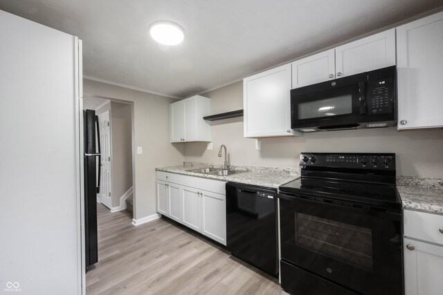 2740 Pawnee Dr, Indianapolis, IN 46229 - kitchen with black appliances, a sink, white cabinetry, and ornamental molding