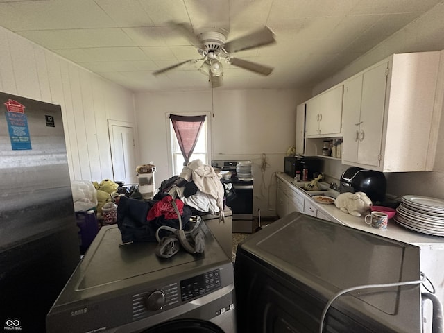 1830 Jefferson St, Anderson, IN 46016 - kitchen featuring washer / dryer, white cabinetry, ceiling fan, and electric stove