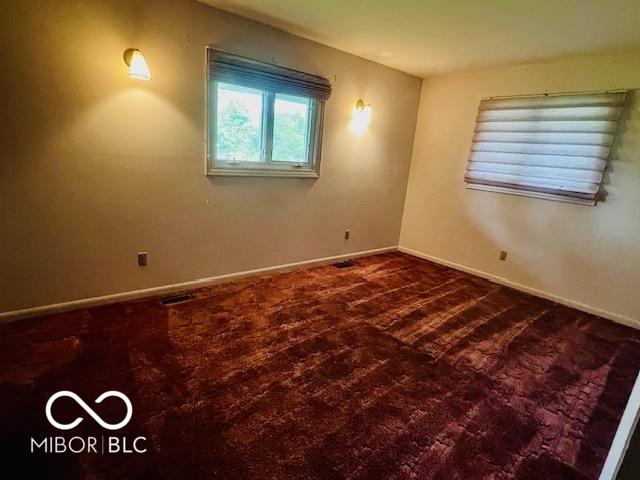 5141 Derome Dr, Fort Wayne, IN 46835 - spare room featuring baseboards and carpet flooring
