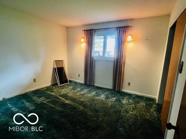 5141 Derome Dr, Fort Wayne, IN 46835 - empty room with dark carpet and baseboards