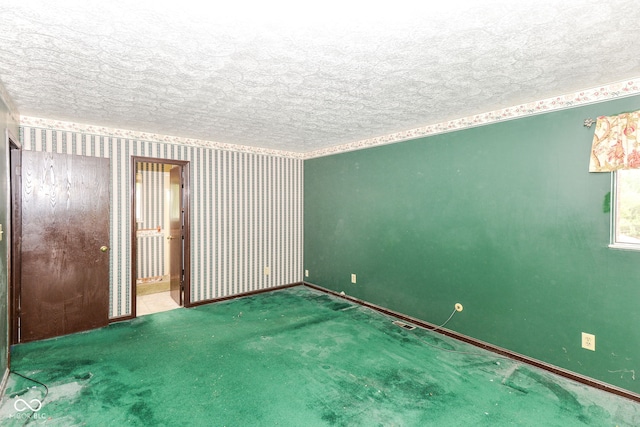 3325 Broadview Ct, Indianapolis, IN 46227 - spare room featuring a textured ceiling, baseboards, carpet flooring, and wallpapered walls