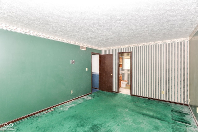 3325 Broadview Ct, Indianapolis, IN 46227 - carpeted empty room featuring a textured ceiling, wallpapered walls, and baseboards