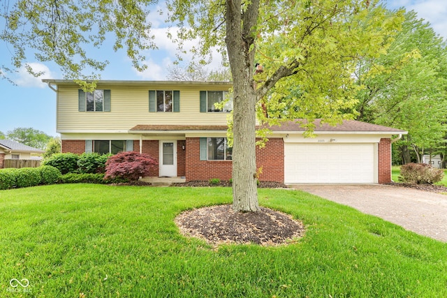 3325 Broadview Ct, Indianapolis, IN 46227 - traditional-style house with driveway, brick siding, a front lawn, and an attached garage