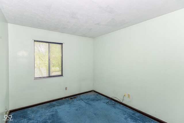 3325 Broadview Ct, Indianapolis, IN 46227 - carpeted empty room featuring baseboards and a textured ceiling