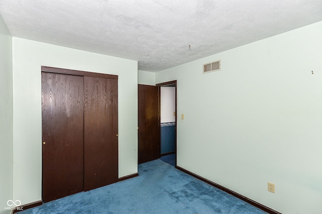 3325 Broadview Ct, Indianapolis, IN 46227 - unfurnished bedroom featuring carpet flooring, a closet, baseboards, and a textured ceiling