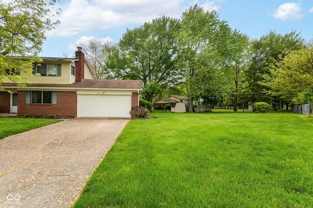3325 Broadview Ct, Indianapolis, IN 46227 - view of green lawn featuring an attached garage and driveway