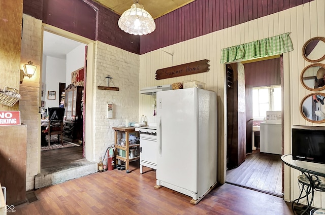 2490 S County Road 60 E, Greensburg, IN 47240 - kitchen with freestanding refrigerator, a towering ceiling, wood finished floors, washer / clothes dryer, and an office area