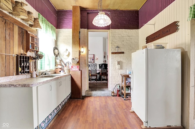 2490 S County Road 60 E, Greensburg, IN 47240 - kitchen with freestanding refrigerator, open shelves, wood finished floors, a sink, and light countertops
