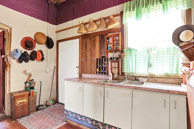 2490 S County Road 60 E, Greensburg, IN 47240 - kitchen featuring a sink, light countertops, white cabinets, and wood finished floors
