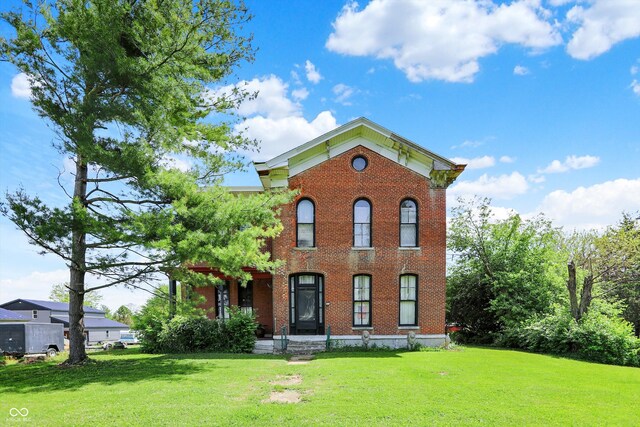 2490 S County Road 60 E, Greensburg, IN 47240 - italianate home featuring a front lawn and brick siding