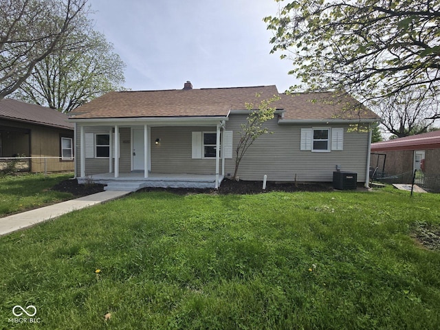view of front of house featuring central AC unit, covered porch, and roof with shingles