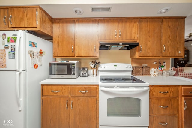 3537 Woodglen Way, Anderson, IN 46011 - kitchen featuring white appliances, under cabinet range hood, light countertops, and brown cabinetry