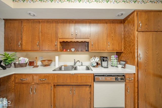 3537 Woodglen Way, Anderson, IN 46011 - kitchen featuring white dishwasher, a sink, light countertops, and brown cabinets