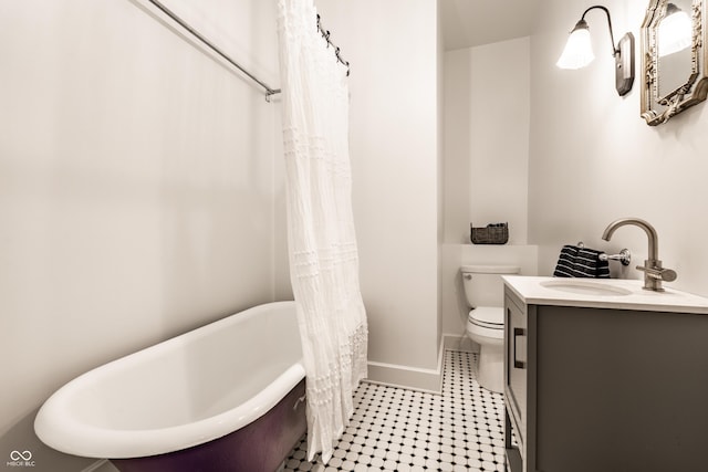 4130 N Meridian St, Indianapolis, IN 46208 - full bathroom with baseboards, a freestanding bath, toilet, and vanity