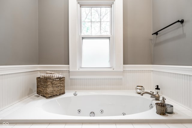 4130 N Meridian St, Indianapolis, IN 46208 - bathroom with a wainscoted wall, a tub with jets, and healthy amount of natural light