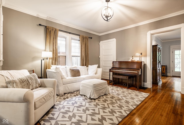 4130 N Meridian St, Indianapolis, IN 46208 - living room featuring hardwood / wood-style floors, crown molding, baseboards, and a chandelier