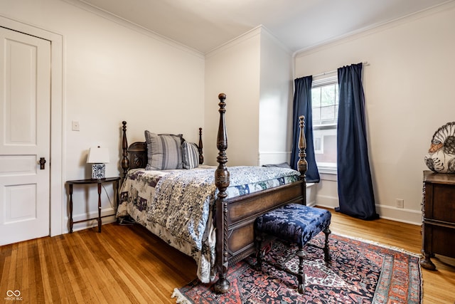 4130 N Meridian St, Indianapolis, IN 46208 - bedroom featuring wood finished floors, crown molding, and baseboards
