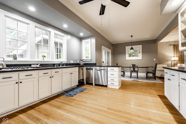4130 N Meridian St, Indianapolis, IN 46208 - kitchen with stainless steel dishwasher, dark countertops, light wood-type flooring, pendant lighting, and recessed lighting