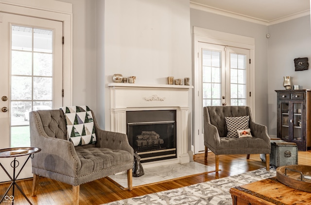 4130 N Meridian St, Indianapolis, IN 46208 - sitting room with wood finished floors, ornamental molding, and a fireplace with flush hearth