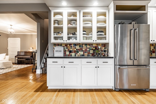 4130 N Meridian St, Indianapolis, IN 46208 - bar area featuring high end refrigerator, crown molding, decorative backsplash, light wood finished floors, and stairway