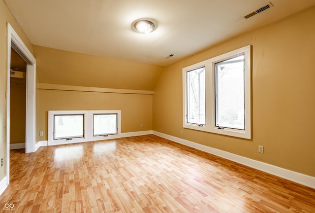4130 N Meridian St, Indianapolis, IN 46208 - additional living space with light wood-style flooring, baseboards, and lofted ceiling
