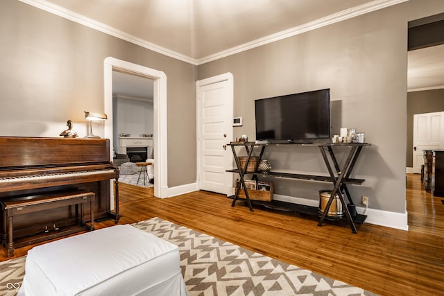 4130 N Meridian St, Indianapolis, IN 46208 - living room featuring wood finished floors, ornamental molding, baseboards, and a fireplace