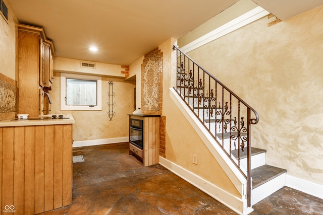 4130 N Meridian St, Indianapolis, IN 46208 - stairs with unfinished concrete flooring, baseboards, and recessed lighting