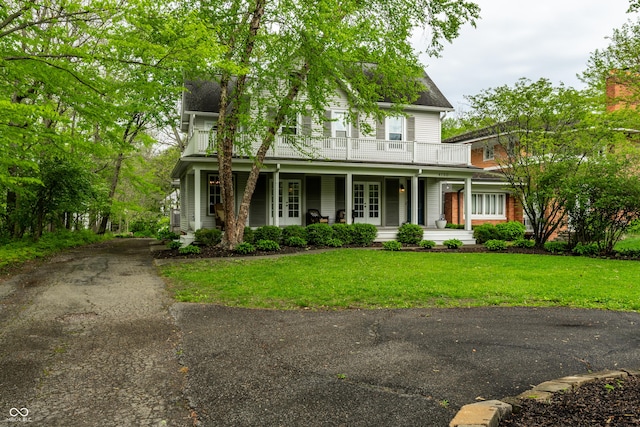4130 N Meridian St, Indianapolis, IN 46208 - view of front facade with french doors, a balcony, a porch, and a front lawn