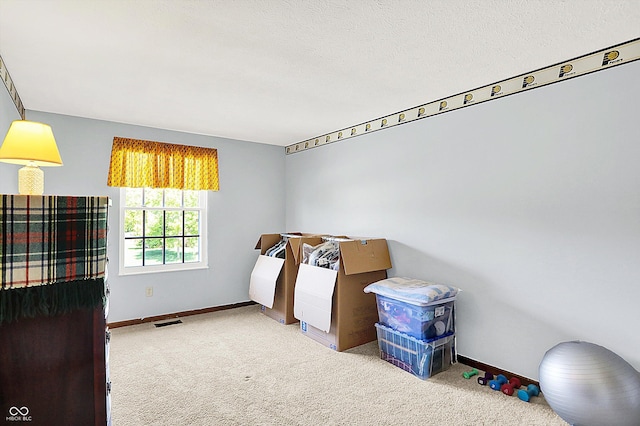 bedroom with carpet floors and baseboards