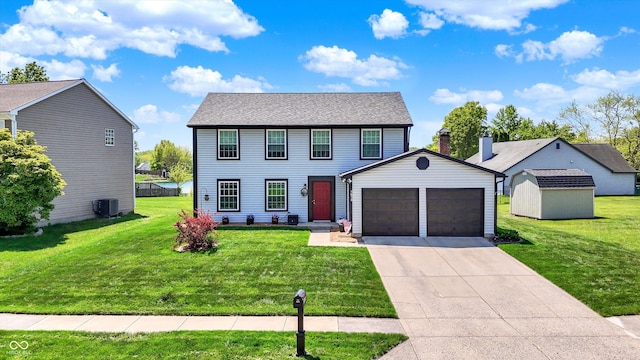 colonial inspired home with central air condition unit, a garage, a front lawn, a storage shed, and concrete driveway